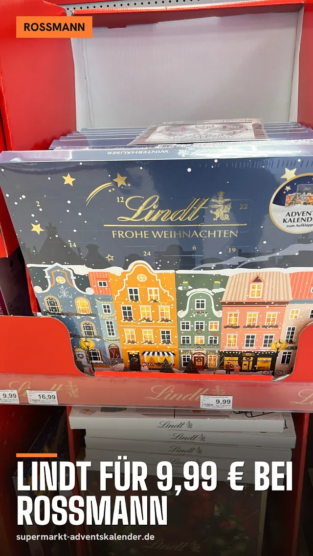 Lindt Adventskalender Winterhäuser im roten Display bei Rossmann mit Preisschild 9,99 €